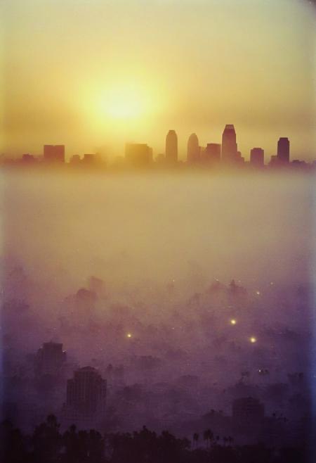 ()Hyoer Realistic:2.0)Polaroid picture 
an image of 
A breathtaking photograph of the early morning dawn in San Diego, California. The golden sun peeks through the clouds, casting a warm glow over the city. (The skyline is dotted with towering skyscrapers that are shrouded in a delicate mist:1.66). The Pacific Ocean is seen in the distance, with gentle waves rolling towards the shore. The atmosphere is serene and peaceful, reflecting the beauty of nature at the break of day.
