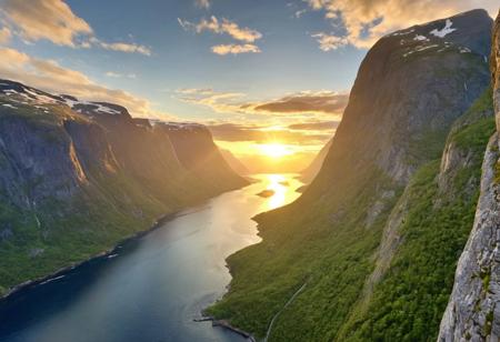 A from_above bird's-eye_view flying through a majestic fjord in Norway, summer, sunset