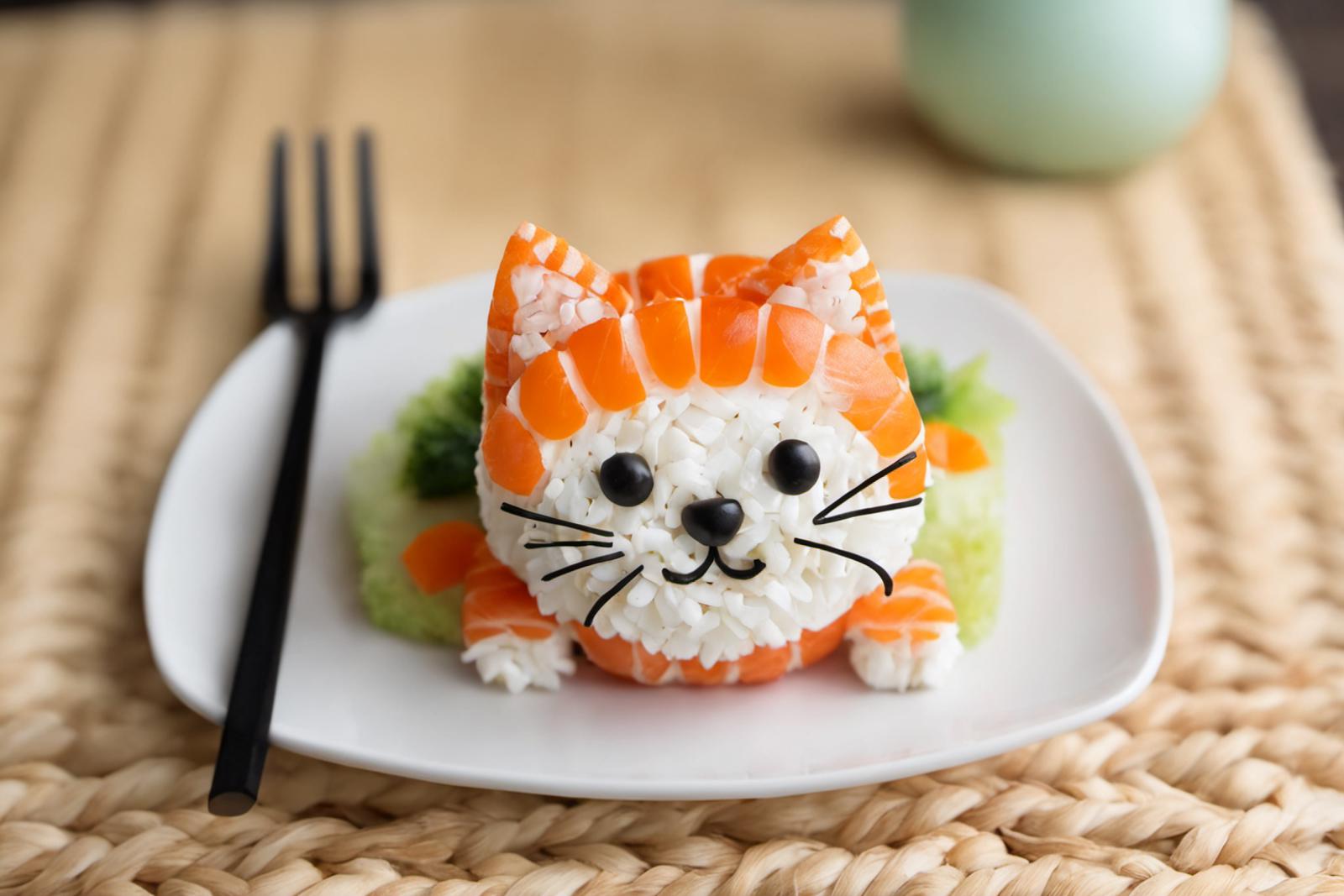 A plate with a cute cat made out of sushi.